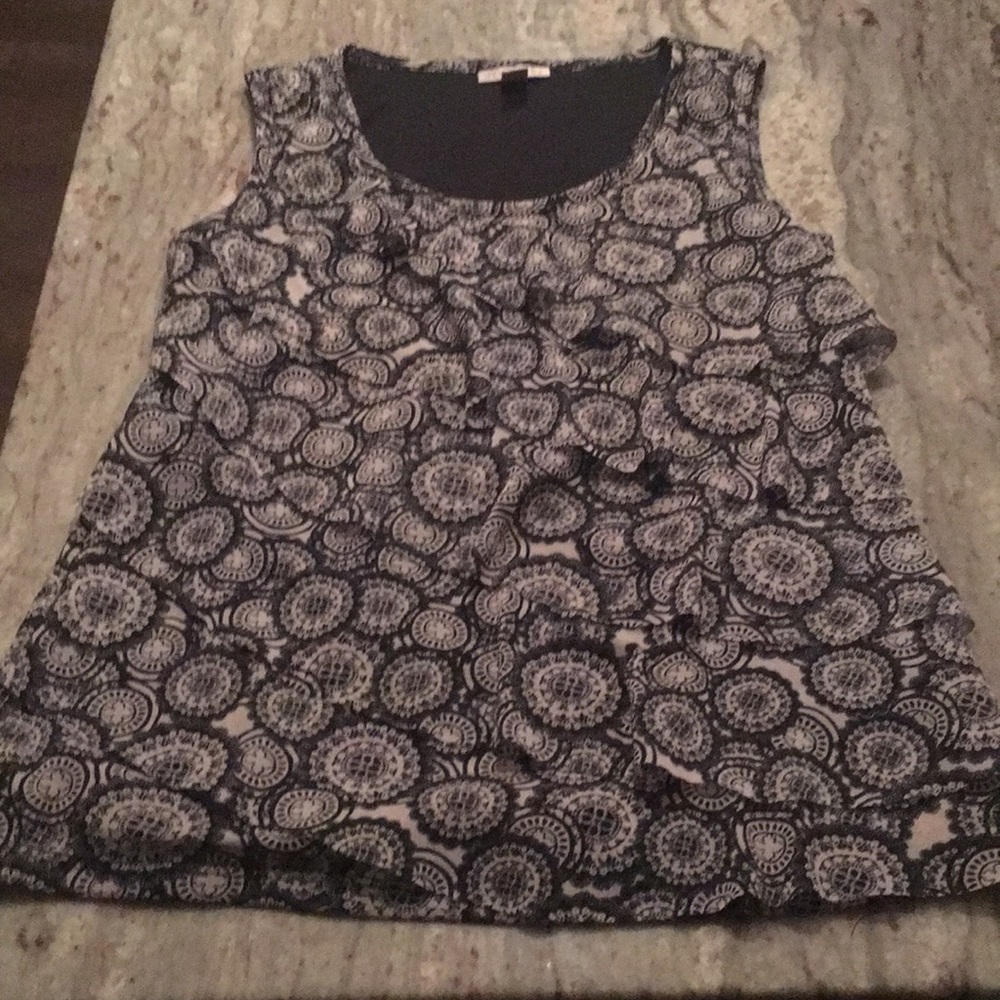 Short sleeved top with ruffled front.